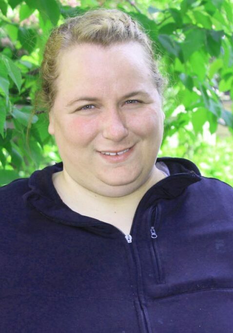 careers supporting people with disabilities lady smiling by trees