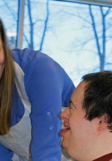 careers helping people with disabilities twin cities girl helping boy smiling