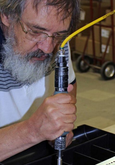 employment service mn guy working in tool shop