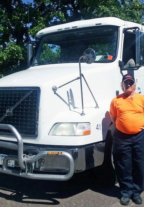 job placement services mpls man standing by truck