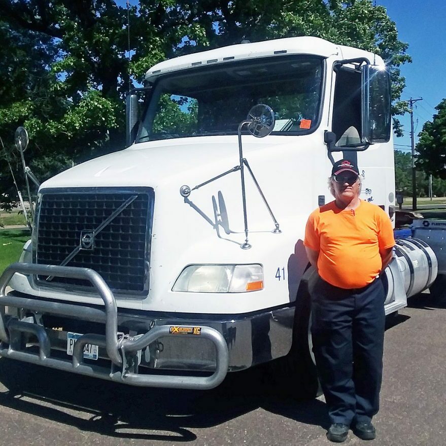 job placement services mpls man standing by truck
