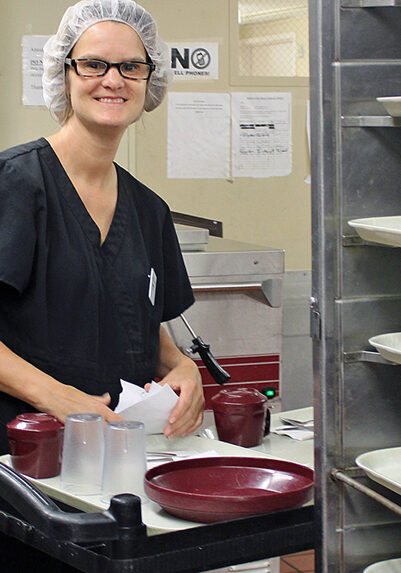 ticket to work twin cities lady working in hair net smiling
