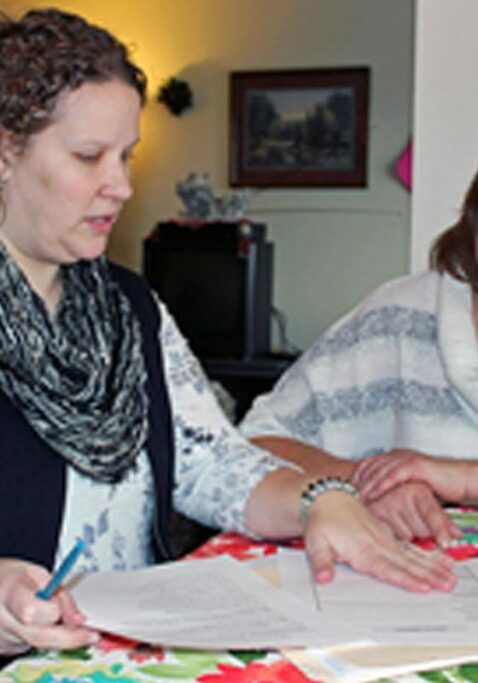 welfare to work employment programs ladies talking over paper work