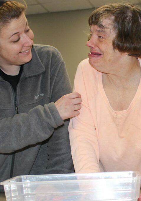 volunteer opportunities rise mn people standing over table in classroom