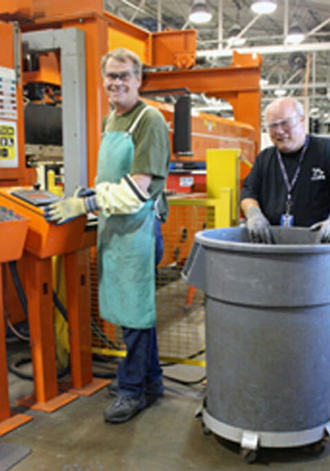 bettering the lives of individuals with disabilities two guys working in factory